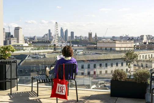 LSE student looking out over view of London from LSE rooftop