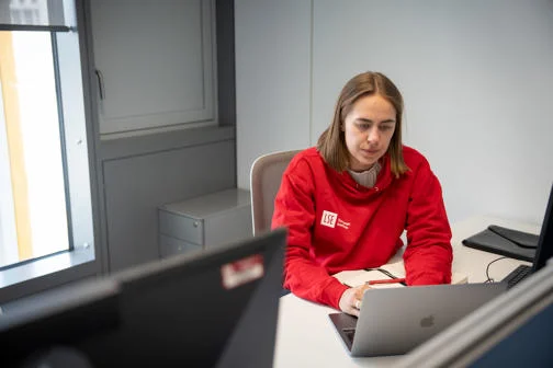 Student studying at a laptop