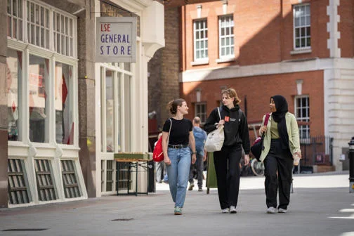 Three students walking on LSE campus