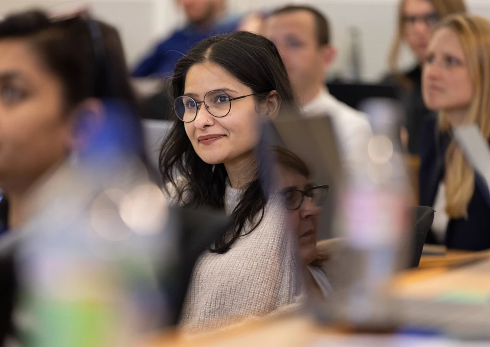 Female student wearing glasses in the classroom