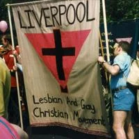 People at a march holding a banner