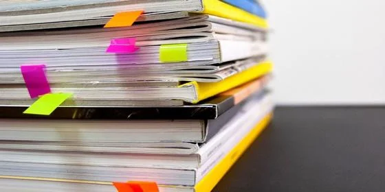 Stack of paper reports