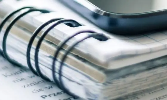 A close up of a pile of notebooks