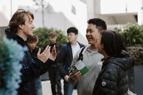 People talking together on campus during Welcome Week.