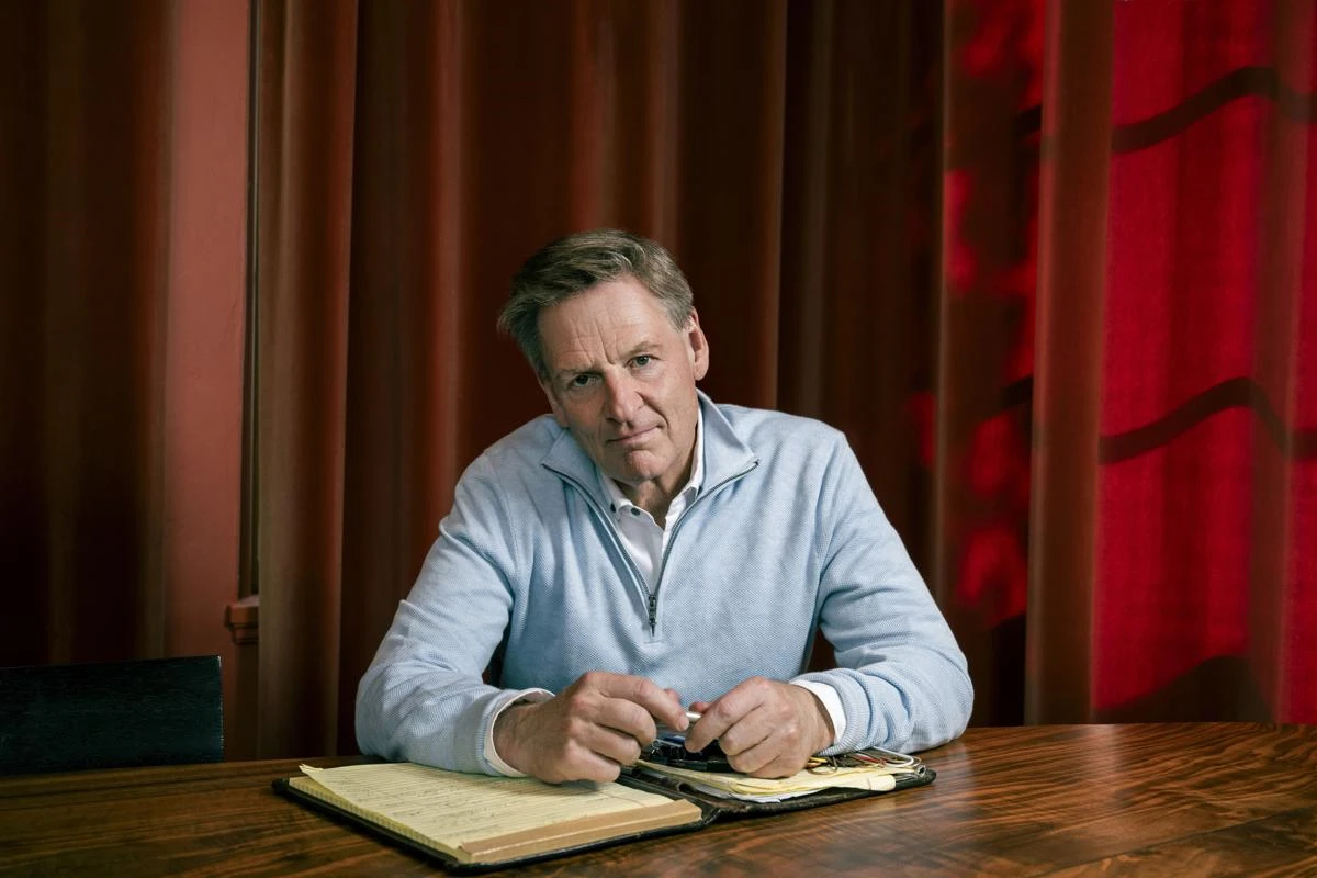Michael Lewis at a table