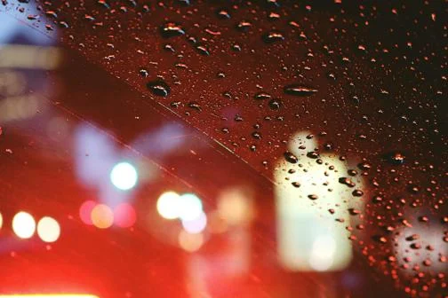 Lights, rain and clear space on a windscreen