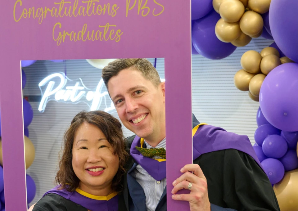 Two Executive MSc Behavioural Science students at graduation