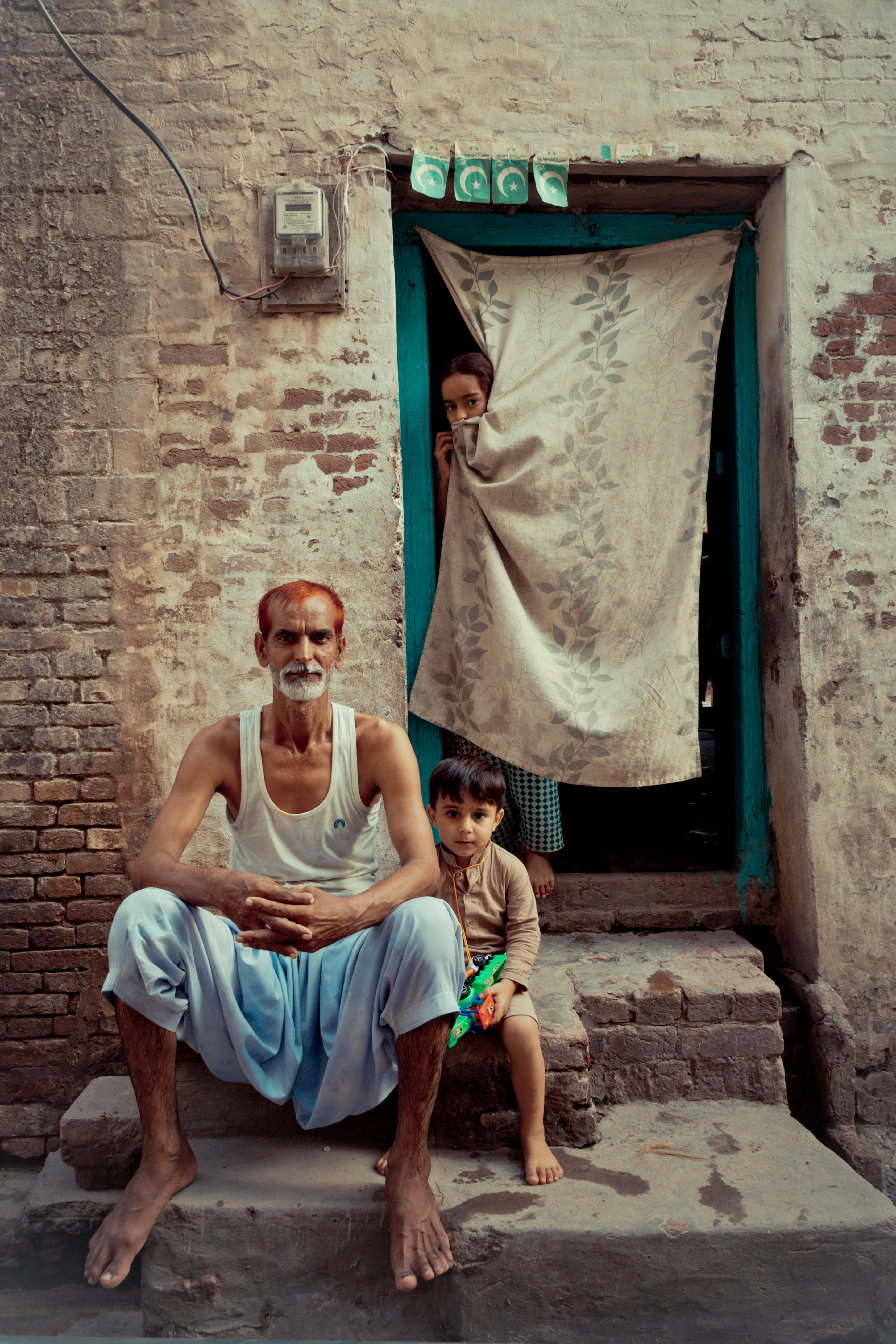 India man and wife with child