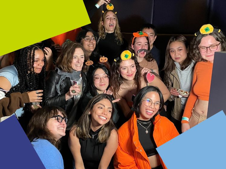 students in photo booth at halloween party with lse squares 747x560