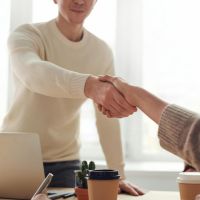 man and woman shaking hands image sourced licence free from pexels 200x200