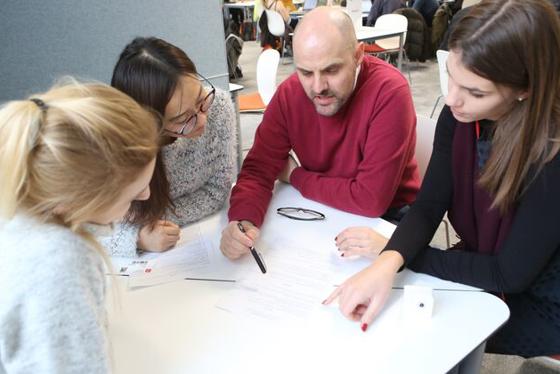 A group of students sitting with an advisor at a LSE LIFE session 