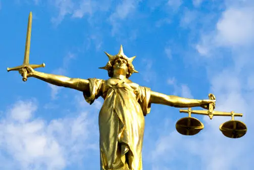The statue of justice, which stands on the Old Bailey courthouse in London.