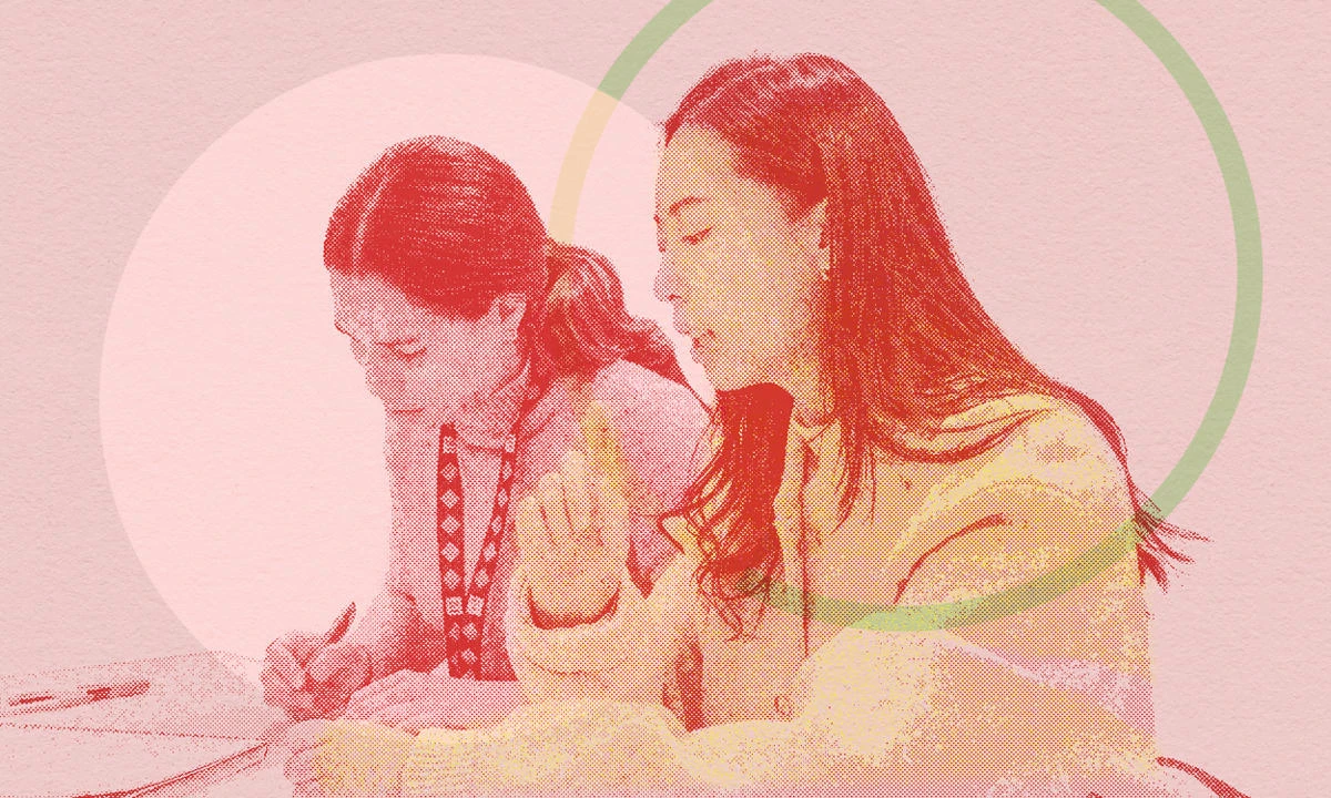 Two women working together