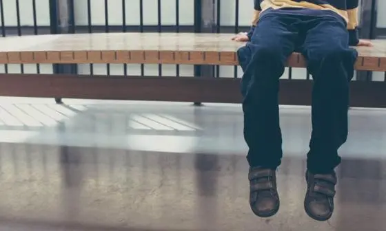 boy sitting on bench