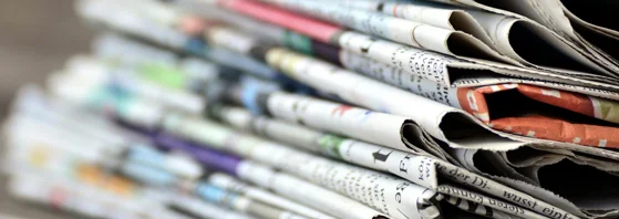 Close-up photo of pile of newspapers