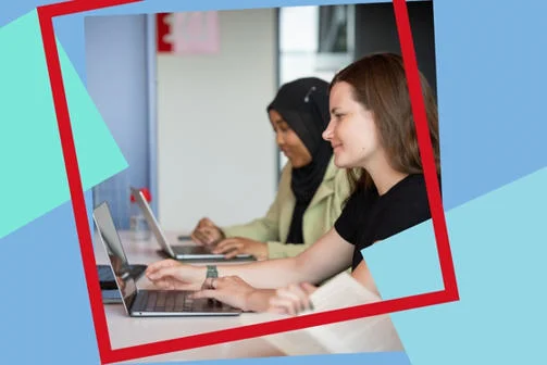 Two students looking at their laptop