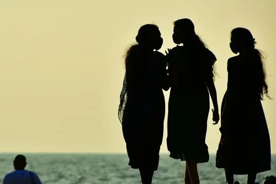 Three women on a beach