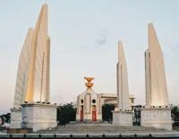 A round monument surrounded by four pillars
