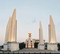 A round monument surrounded by four pillars