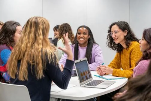 a group of students laugh together