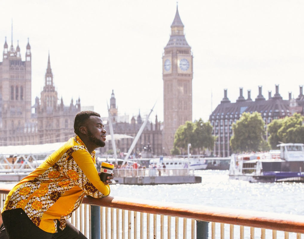 LSE student looking out over bridge in London with view of Westminster