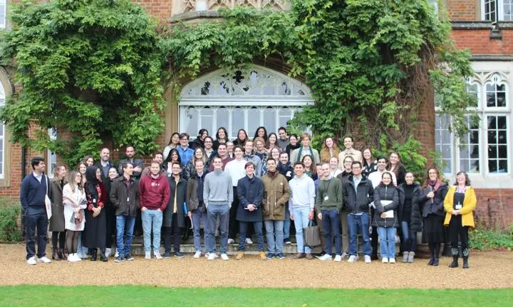Group of students standing outside Cumberland Lodge