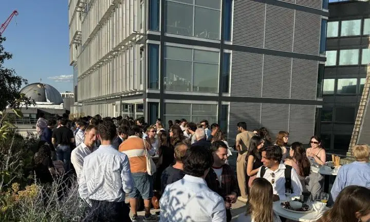 Group of people chatting in the sunshine