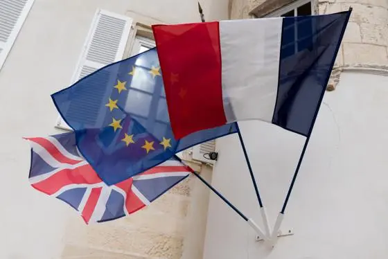 French, UK and EU flags flying from a building. IR DEPT ONLY (iStock)