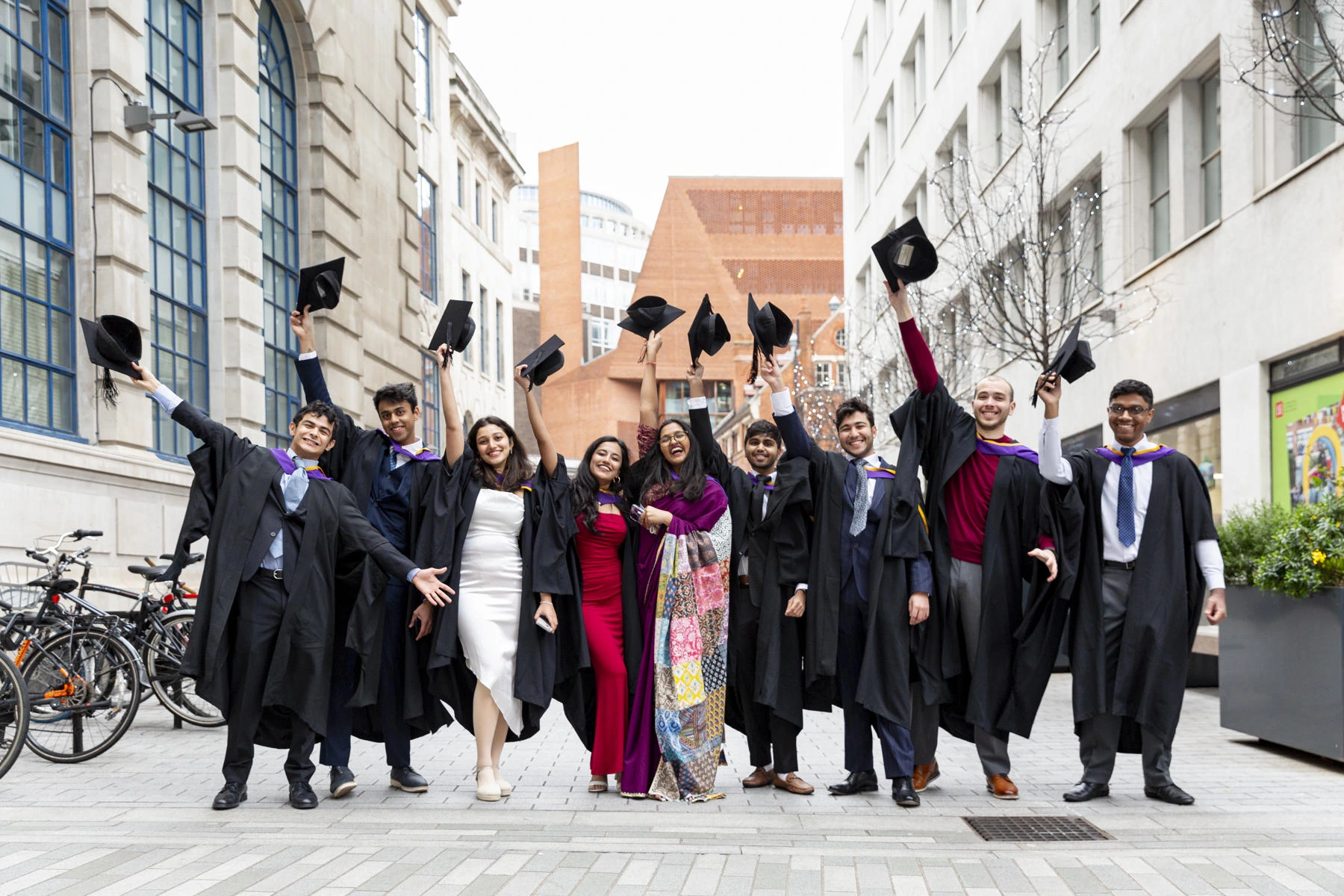 Graduates celebrating on campus.