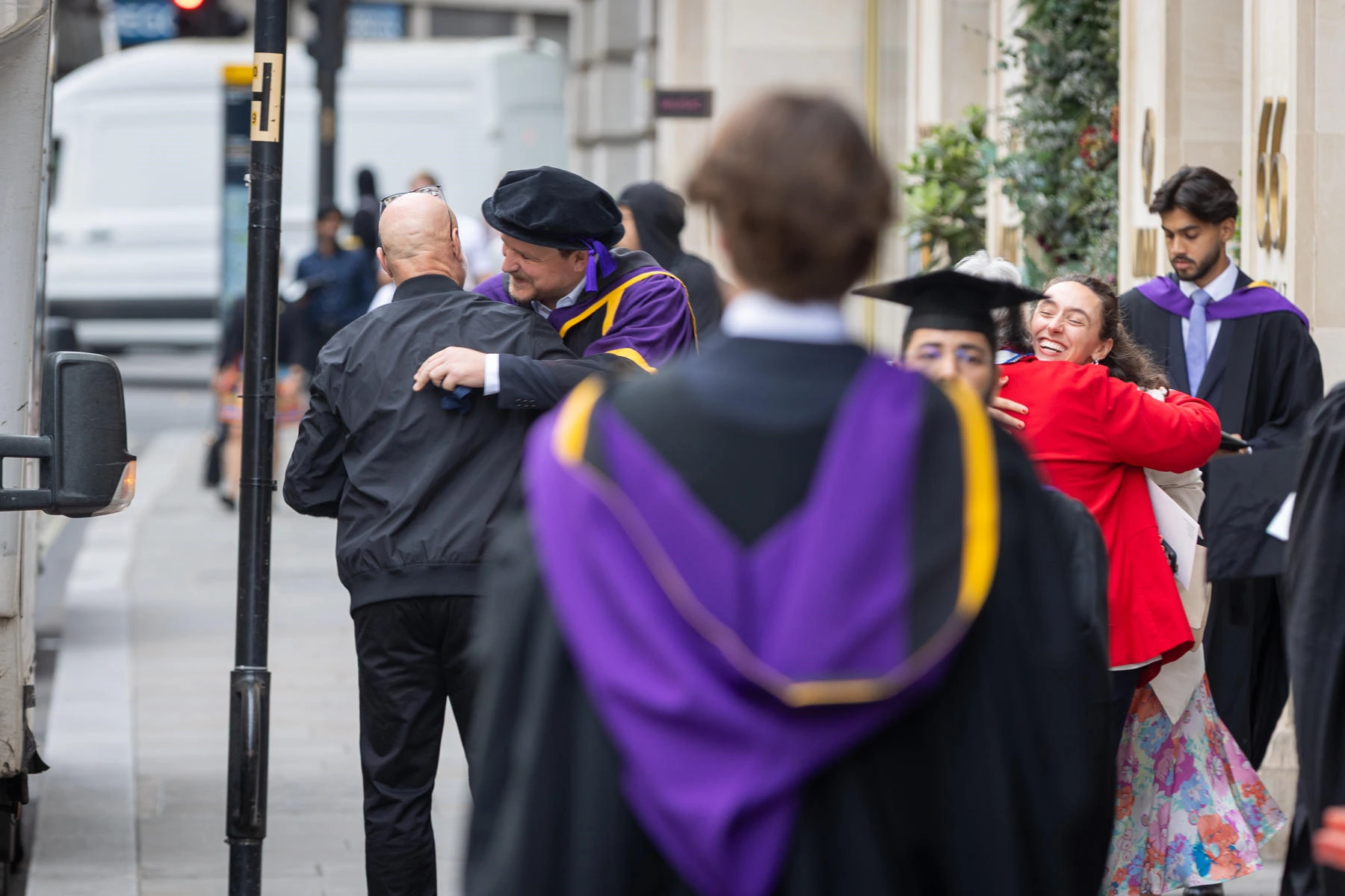 Graduates and family members hugging