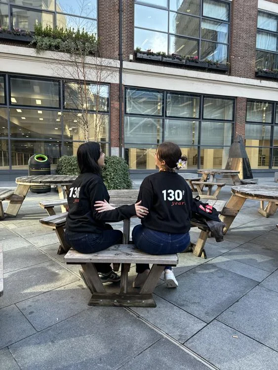 two students wearing LSE 130 jumpers
