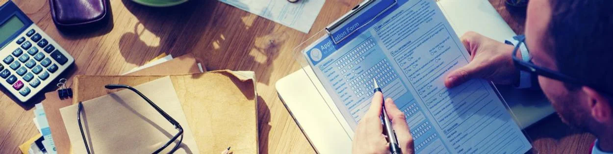 a man filling in a form