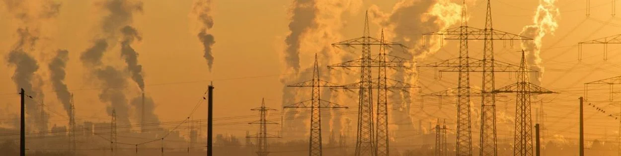A skyline with pollution and electricity pylons
