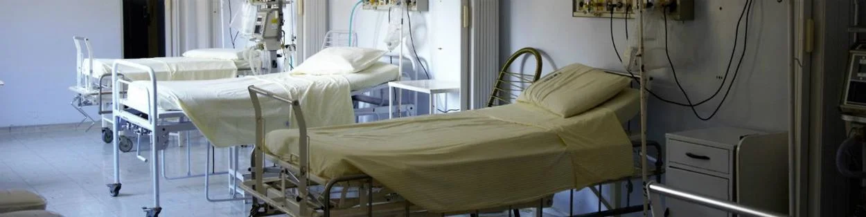 Hospital beds lined up in a row