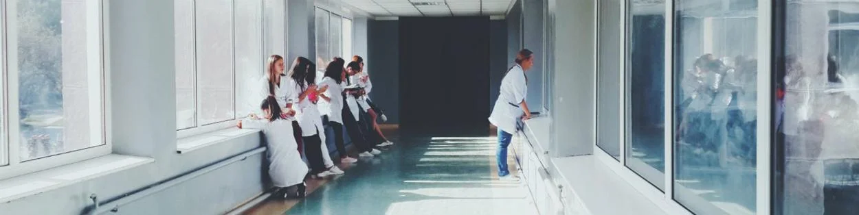 A corridor with doctors and nurses at a hospital.
