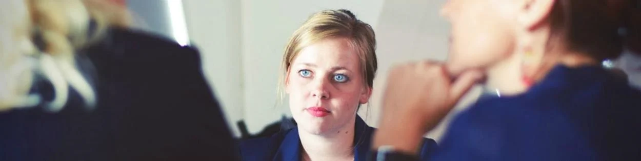 Professional people talking in an office.