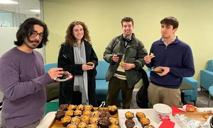 Students enjoying muffins in the undergraduate study room.