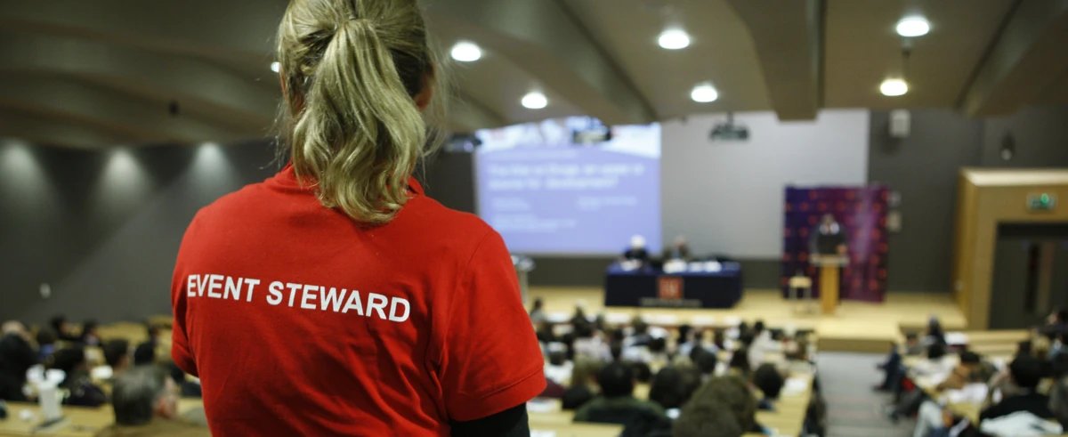 LSE Events steward in a full Sheikh Zayed Theatre
