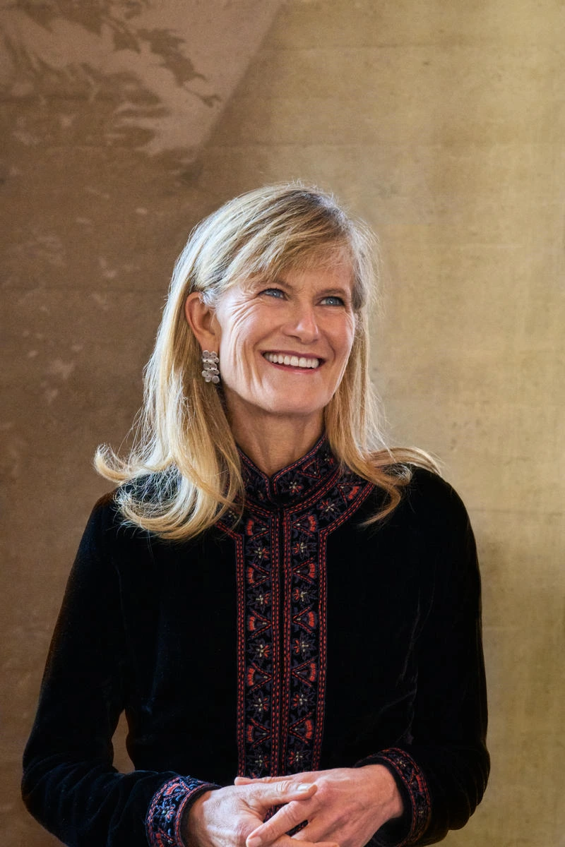 Jacqueline wearing a patterned black top