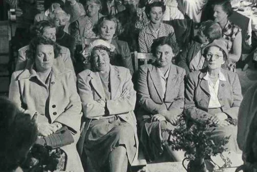 A group of women seated listening to a talk