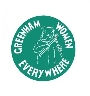 A green logo with Greenham Women Everywhere and a woman with bolt cutters.