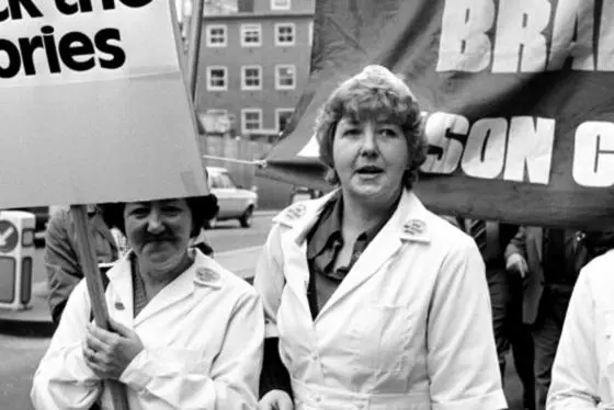 A group of protestors with placards and banners.