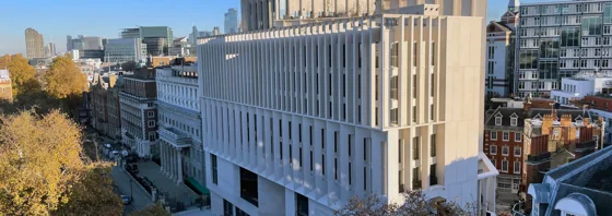 Arial shot of a white modern building (the Marshall Building)