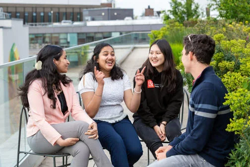Students chatting on an LSE rooftop.
