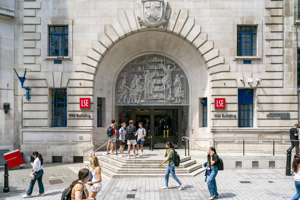 People walking past LSE old building