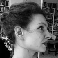 A black and white sideways headshot of Helen Mackreath