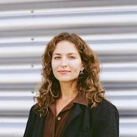 Headshot for Katie Mulkowsky, PhD candidate in regional and urban planning studies