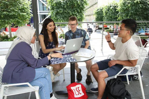 Students relaxing at the Plaza Cafe, overlooking the new LSE Square in front of the Centre Building
