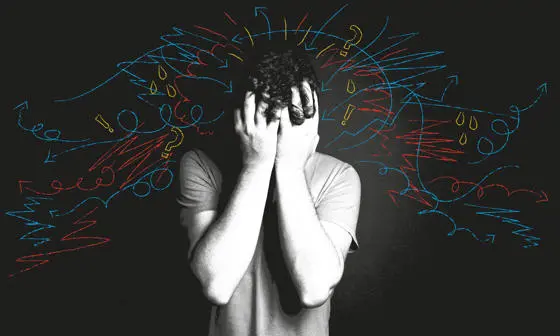 A man with his head in his hands.