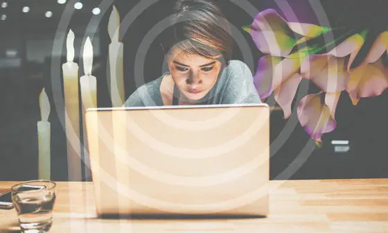 A woman looking at a laptop